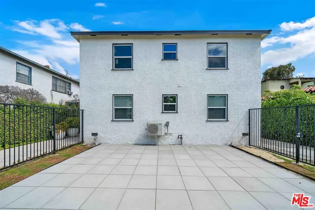 a kitchen with stainless steel appliances granite countertop a refrigerator sink and stove