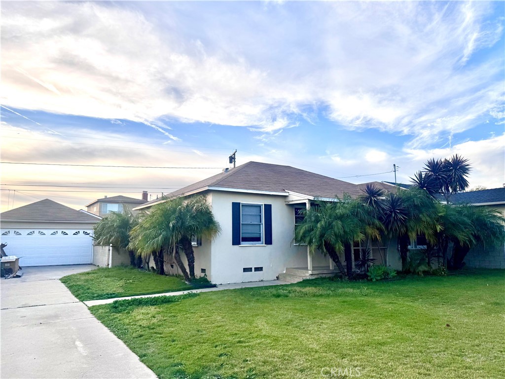 15523 Ruthelen Street Gardena, CA 90249 - Photo 2 of 9 a front view of a house with a garden