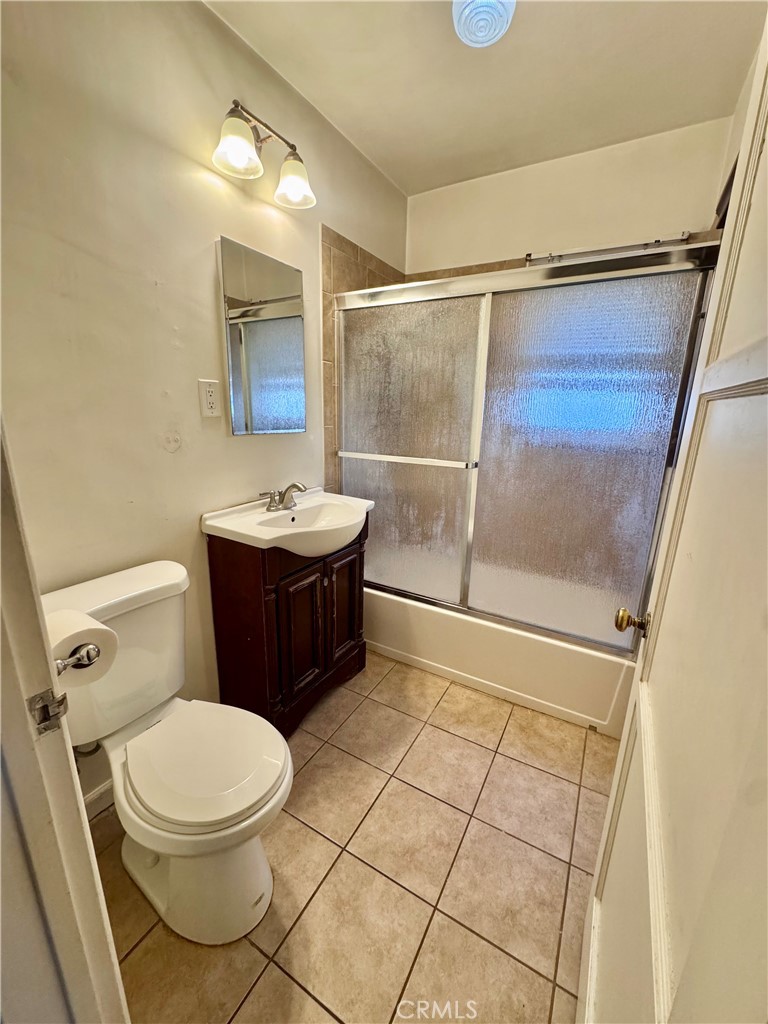15523 Ruthelen Street Gardena, CA 90249 - Photo 3 of 9 a bathroom with a toilet a sink and a shower