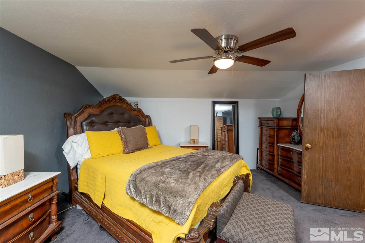630 Cardinal Way Reno, NV 89509 - Photo 19 of 35 a bedroom with a bed and dresser
