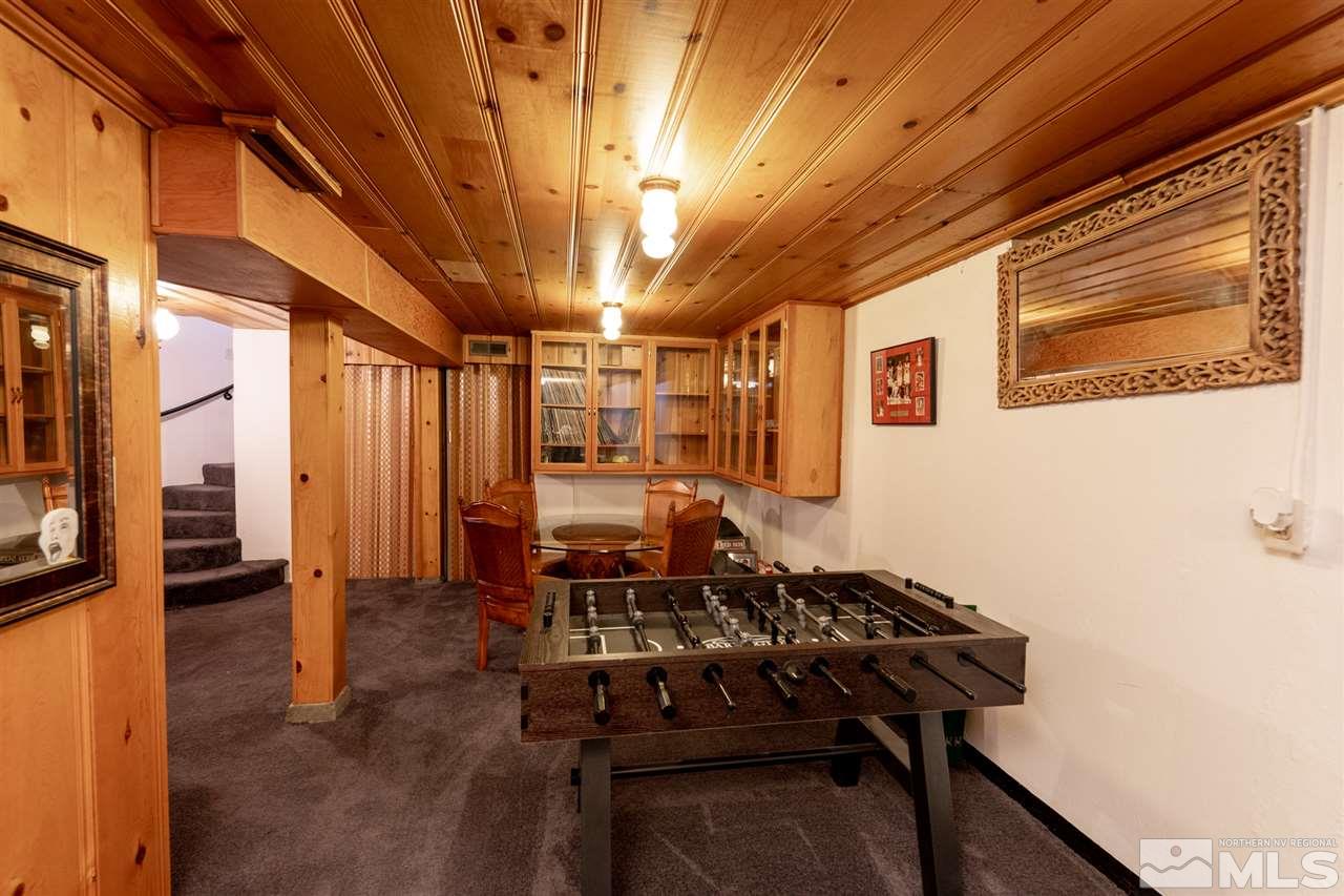 630 Cardinal Way Reno, NV 89509 - Photo 26 of 35 a dining room with furniture and a chandelier