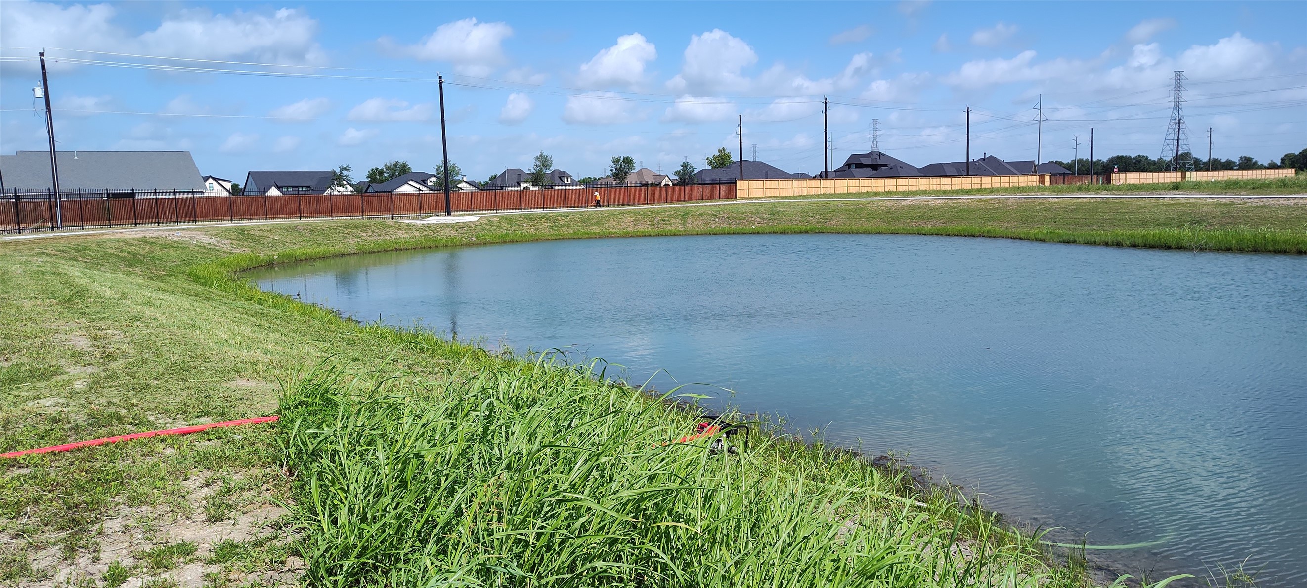 15423 Pinehurst Lane Santa Fe, TX 77517 - Photo 8 of 10 a view of a lake with swimming pool