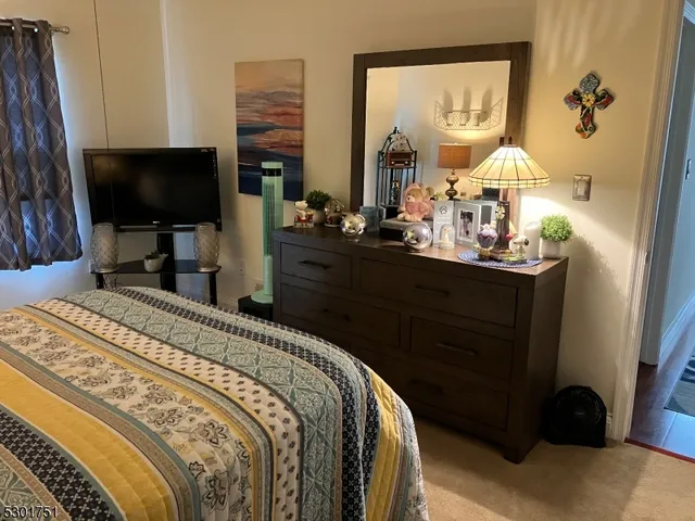 a bathroom with a toilet and a mirror