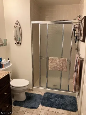 a living room with furniture and a large mirror