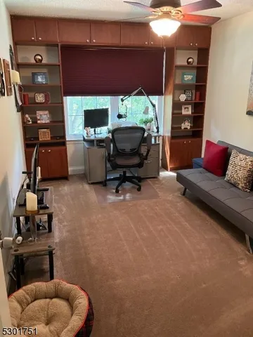 a bathroom with a granite countertop sink toilet and a mirror