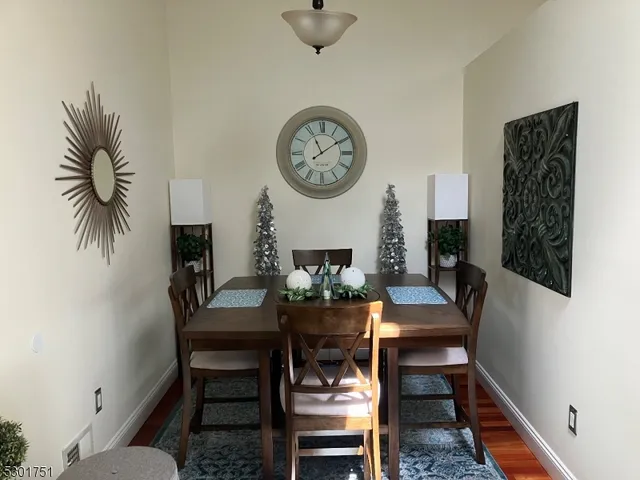 a view of a dining room with furniture and a table