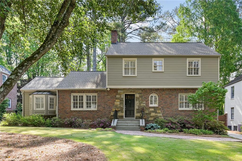 front view of a house with a yard
