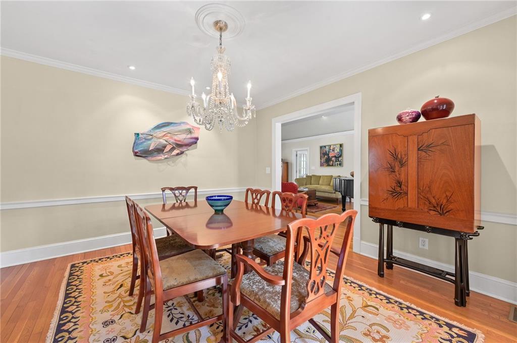 1735 Johnson Road Northeast Atlanta, GA 30306 - Photo 13 of 54 a view of a dining room with furniture and chandelier