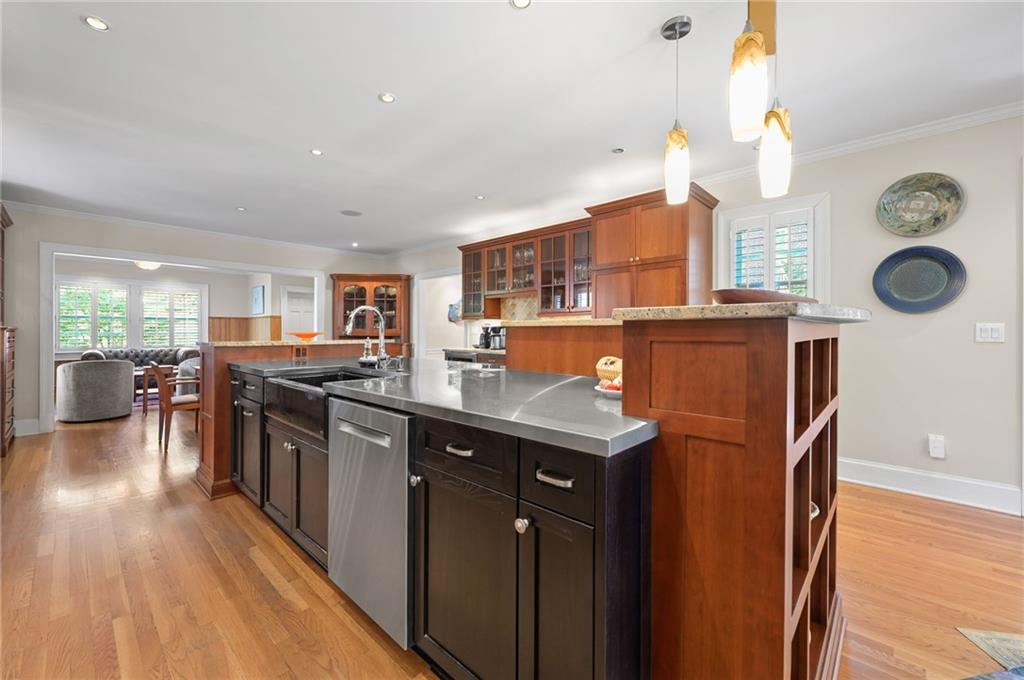 1735 Johnson Road Northeast Atlanta, GA 30306 - Photo 16 of 54 a kitchen with stainless steel appliances granite countertop a stove a sink dishwasher and a refrigerator with wooden floor
