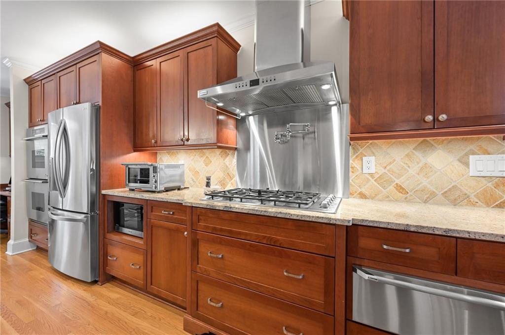 1735 Johnson Road Northeast Atlanta, GA 30306 - Photo 17 of 54 a kitchen with stainless steel appliances granite countertop a refrigerator and a stove