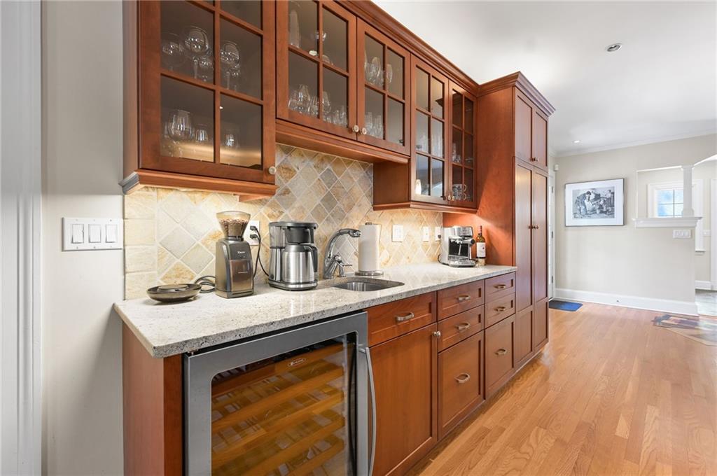 1735 Johnson Road Northeast Atlanta, GA 30306 - Photo 18 of 54 a kitchen with stainless steel appliances granite countertop a sink stove and cabinets