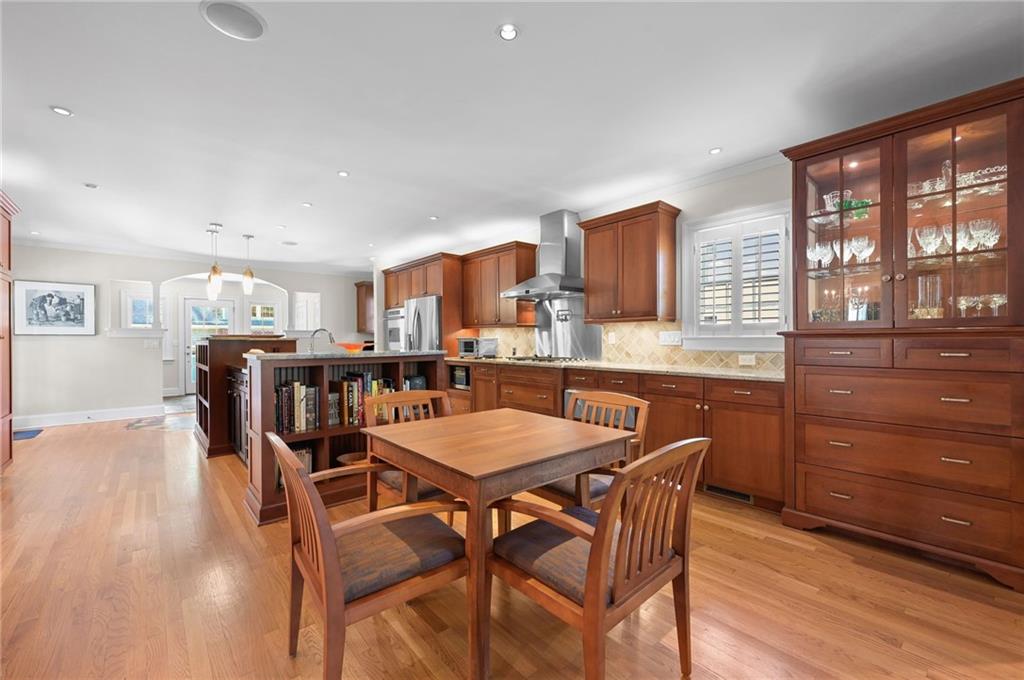 1735 Johnson Road Northeast Atlanta, GA 30306 - Photo 20 of 54 a dining room with a wooden table and chairs