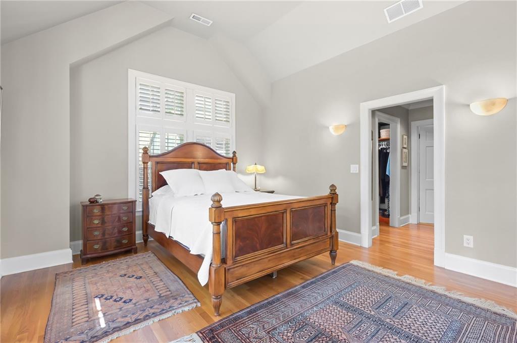 1735 Johnson Road Northeast Atlanta, GA 30306 - Photo 26 of 54 a bedroom with a bed and wooden floor