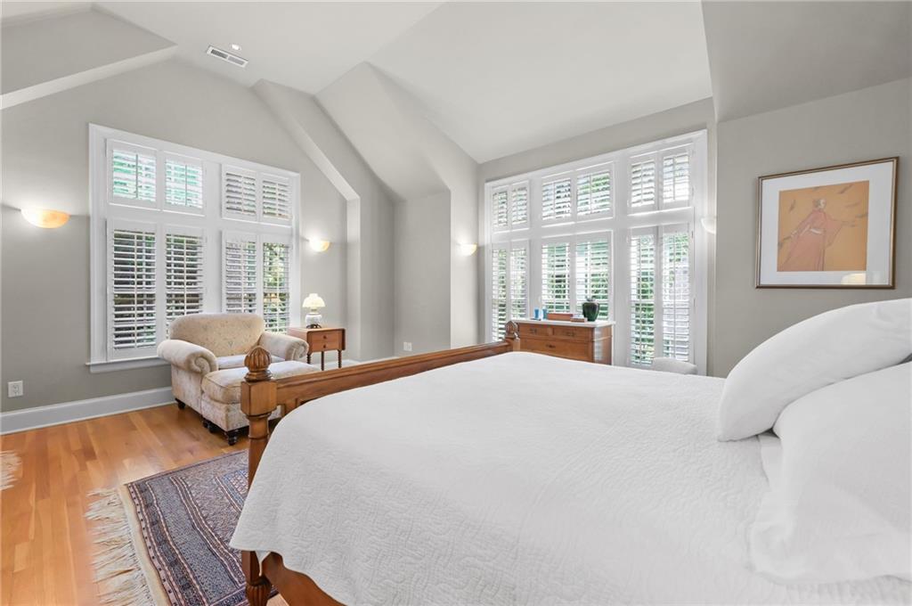 1735 Johnson Road Northeast Atlanta, GA 30306 - Photo 28 of 54 a bedroom with bed and wooden floor