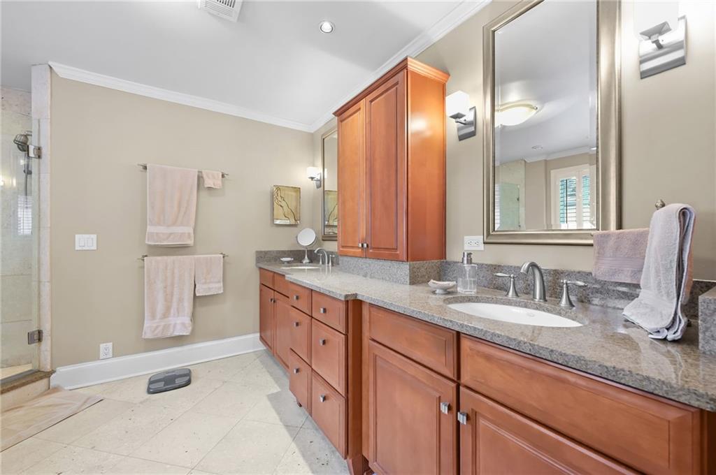 1735 Johnson Road Northeast Atlanta, GA 30306 - Photo 29 of 54 a bathroom with double vanity sinks double vanity and a shower