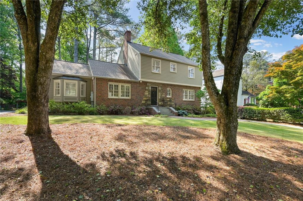1735 Johnson Road Northeast Atlanta, GA 30306 - Photo 3 of 54 a front view of a house with garden