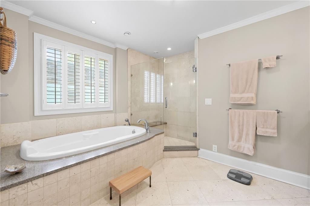 1735 Johnson Road Northeast Atlanta, GA 30306 - Photo 31 of 54 a spacious bathroom with a tub sink and mirror