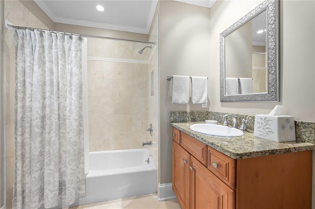 1735 Johnson Road Northeast Atlanta, GA 30306 - Photo 34 of 54 a bathroom with a granite countertop sink and a mirror
