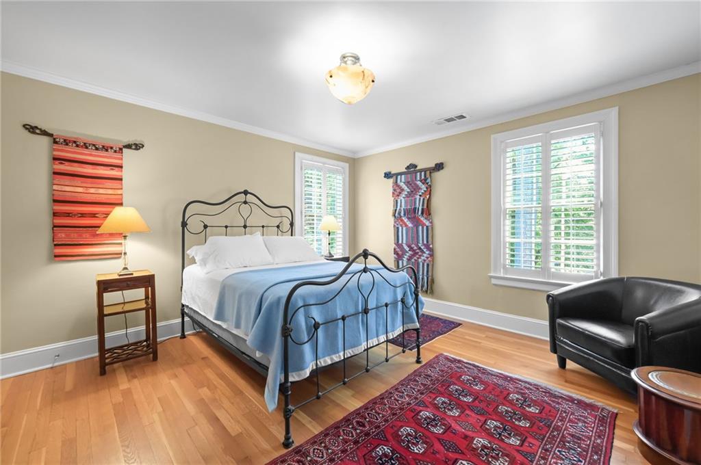 1735 Johnson Road Northeast Atlanta, GA 30306 - Photo 35 of 54 a bedroom with a bed couch and a window