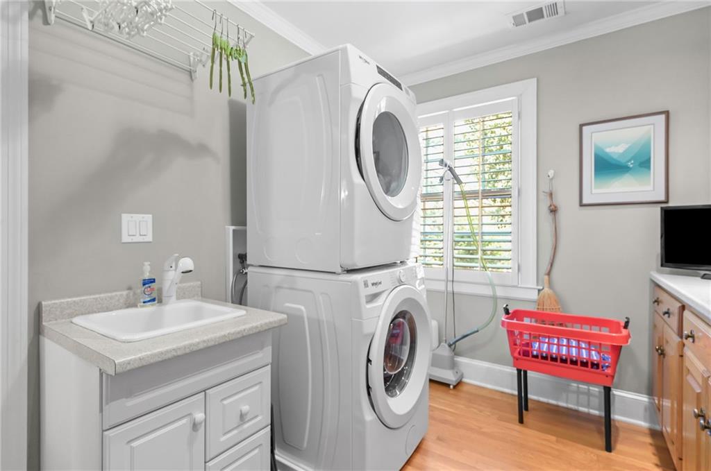 1735 Johnson Road Northeast Atlanta, GA 30306 - Photo 39 of 54 a bathroom with a sink a washer and dryer