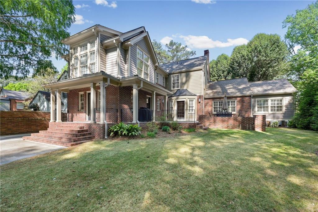 1735 Johnson Road Northeast Atlanta, GA 30306 - Photo 42 of 54 front view of a house with a yard
