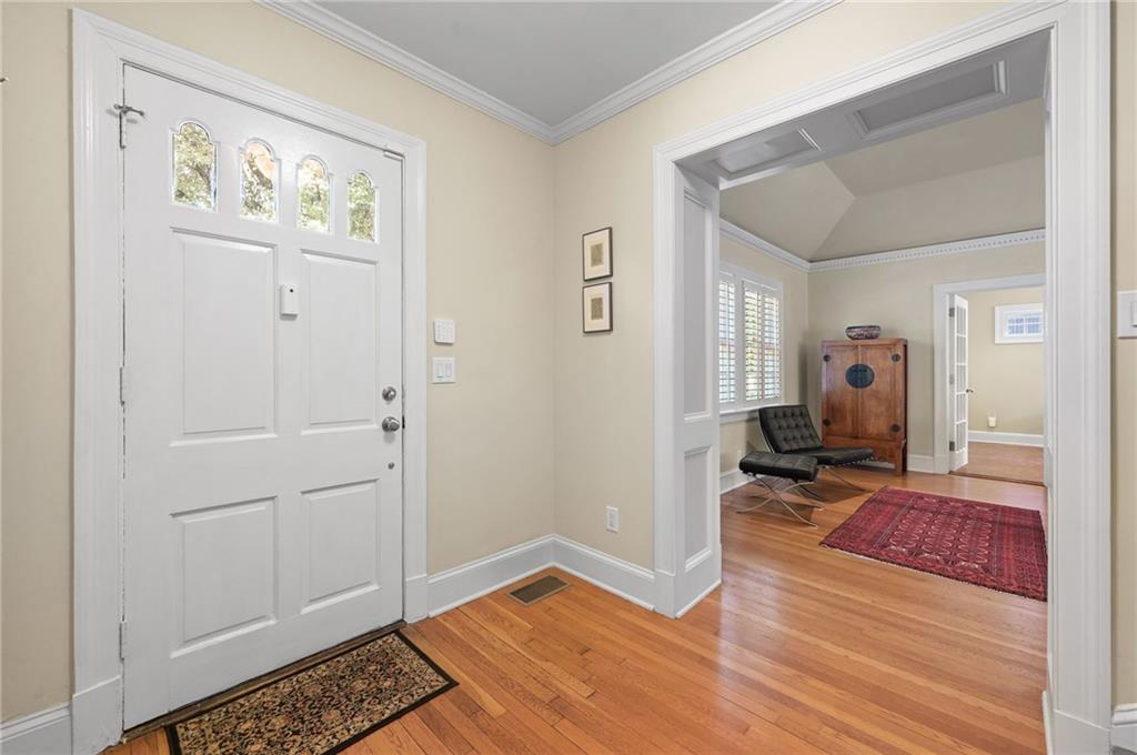1735 Johnson Road Northeast Atlanta, GA 30306 - Photo 6 of 54 a view of a hallway with wooden floor and closet