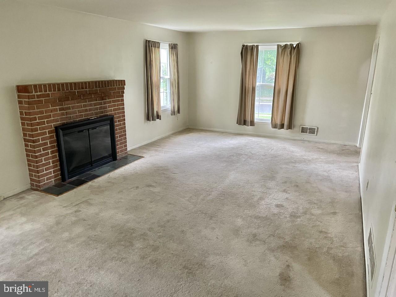 7013 Copeleigh Road Baltimore, MD 21212 - Photo 4 of 24 Living room with wood burning fireplace