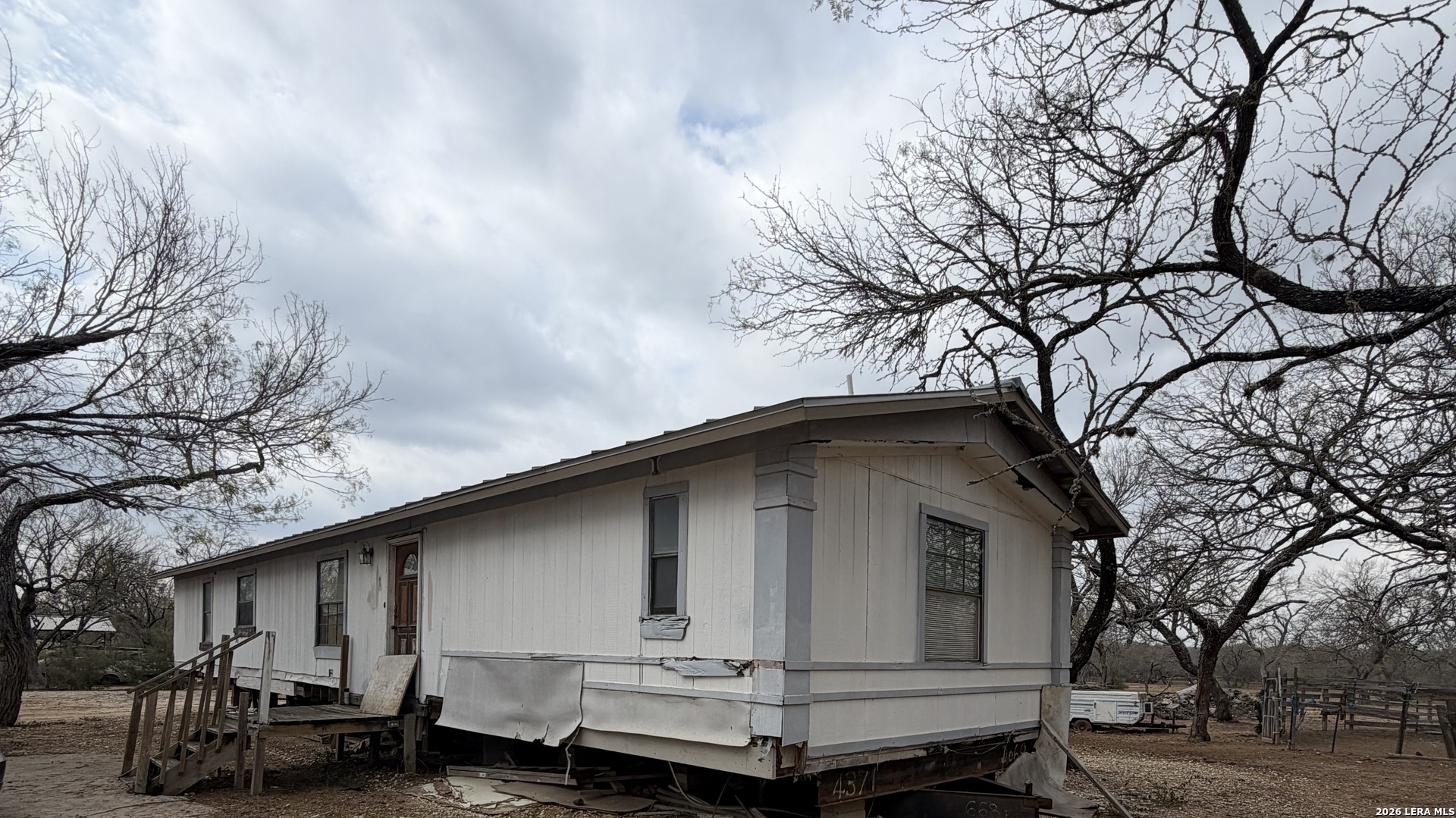 21115 Spanish Grant Road San Antonio, TX 78264 - Photo 11 of 23 a small barn in front of a house