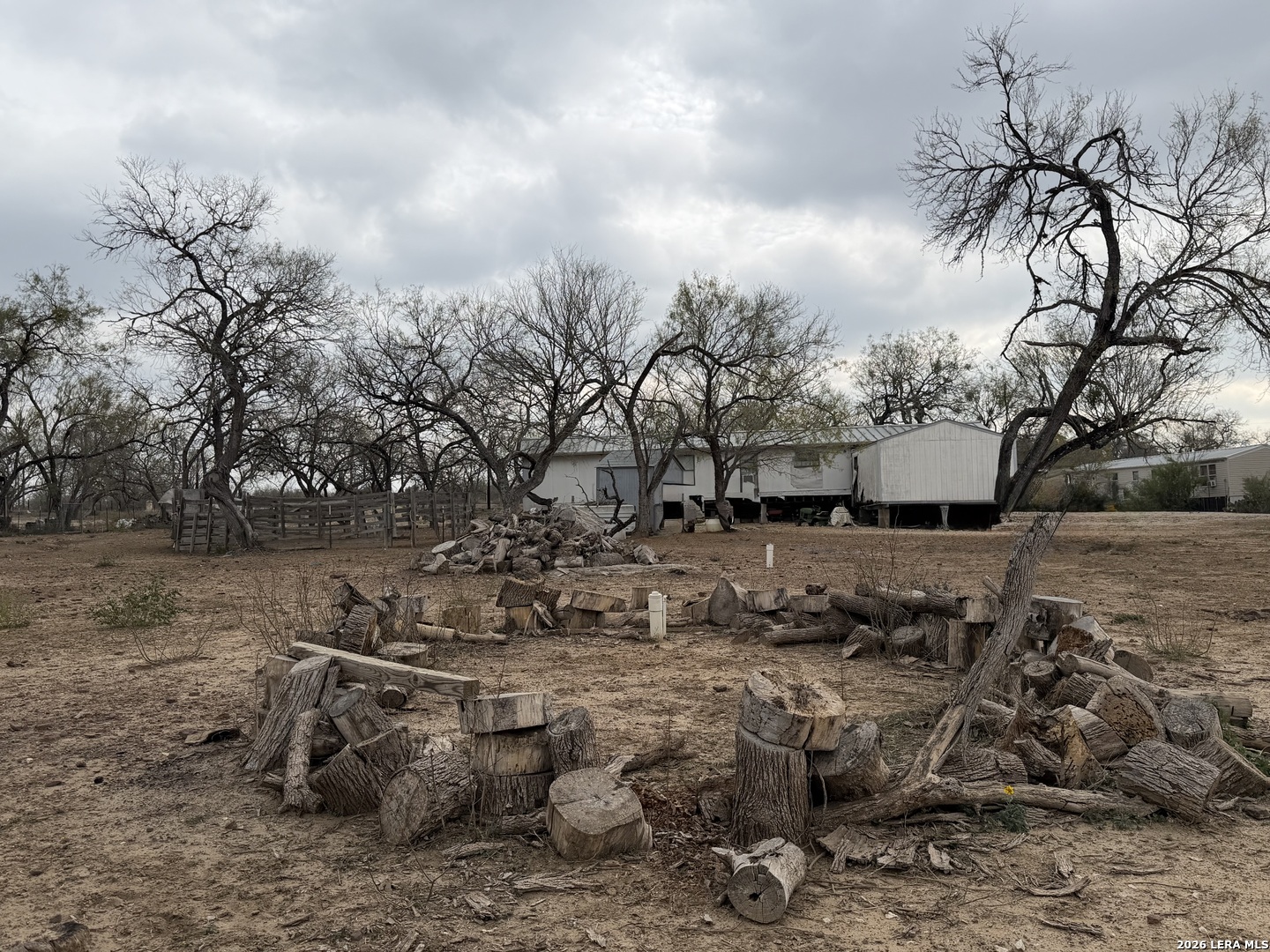 21115 Spanish Grant Road San Antonio, TX 78264 - Photo 15 of 23 a view of a yard with wooden fence