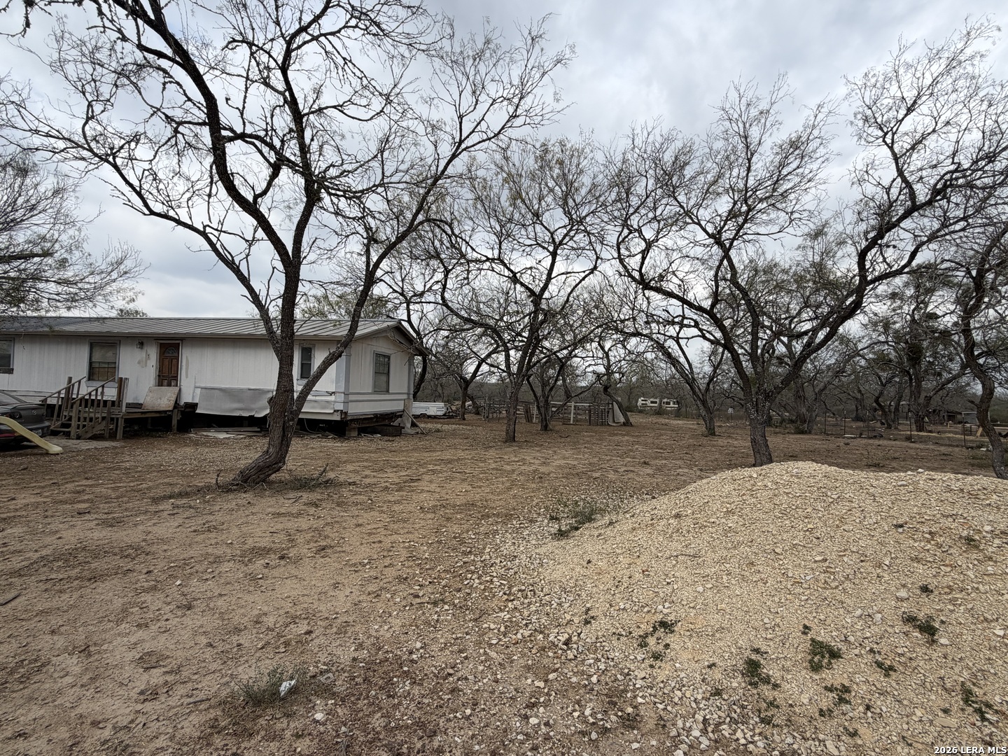 21115 Spanish Grant Road San Antonio, TX 78264 - Photo 9 of 23 a view of a yard with tree s