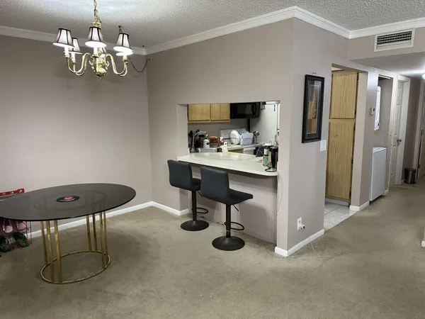 a view of a workspace with furniture
