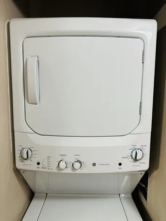 a view of washer and dryer with a mirror