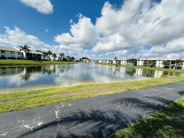 a view of a lake with houses in the back