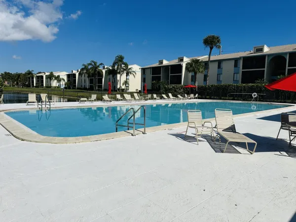 a view of a swimming pool with a patio