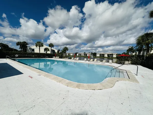 a view of a swimming pool with a chair