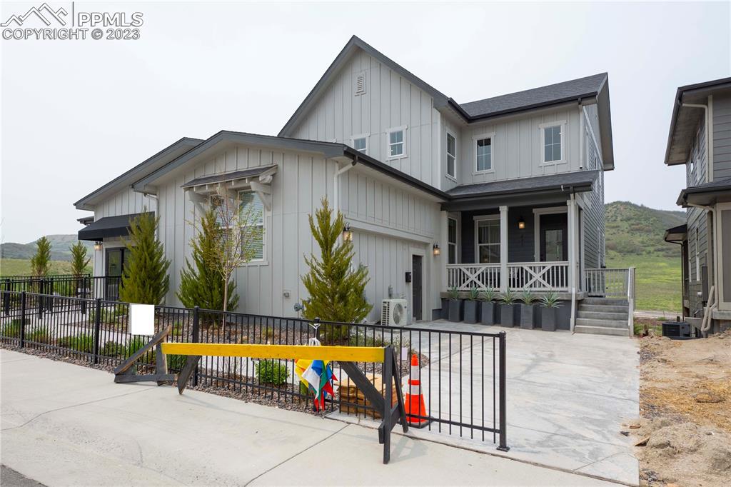 a view of house with swimming pool outdoor seating