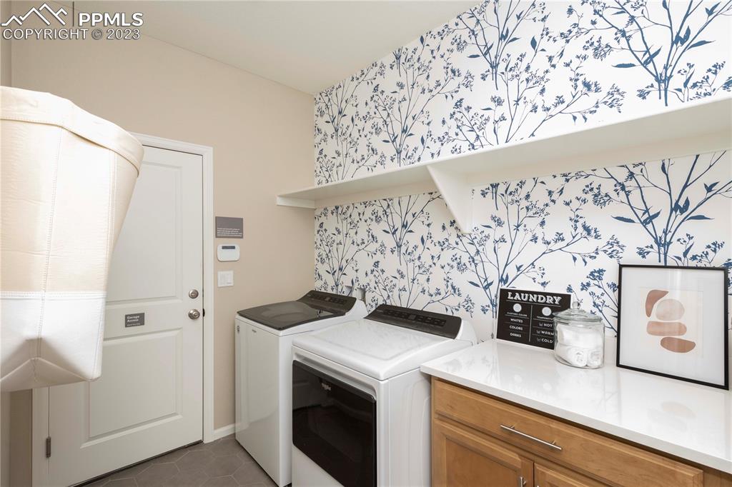 631 Felicity Loop Castle Rock, CO 80109 - Photo 16 of 33 a view of utility room with washer and dryer