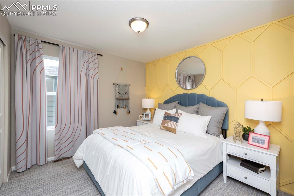 631 Felicity Loop Castle Rock, CO 80109 - Photo 28 of 33 a bedroom with a bed and a painting on the wall