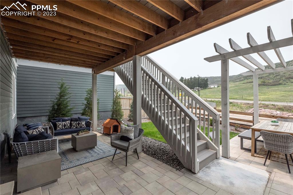 631 Felicity Loop Castle Rock, CO 80109 - Photo 31 of 33 a balcony with furniture and wooden floor