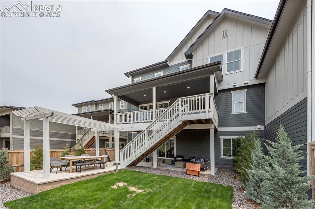 631 Felicity Loop Castle Rock, CO 80109 - Photo 33 of 33 a view of a house with wooden deck and a big yard