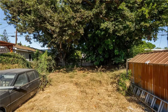a view of backyard with green space