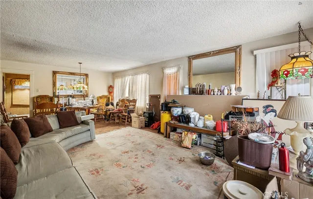 a living room with lots of furniture and a wooden floor
