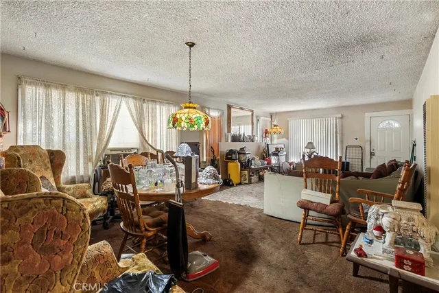 a view of a livingroom with furniture water and a chandelier