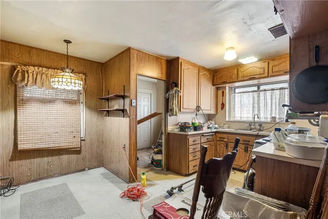 a very nice looking kitchen with a large window