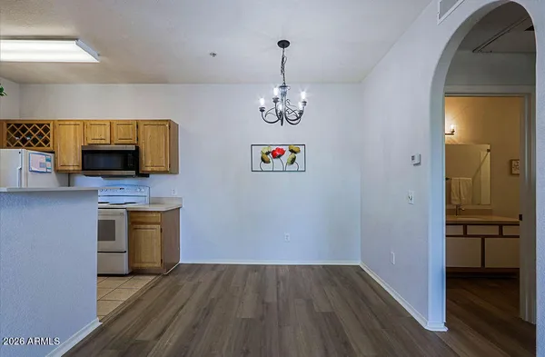 a bathroom with a shower curtain and a toilet