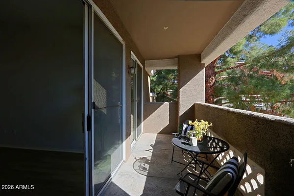 a view of a sign board with flower plants