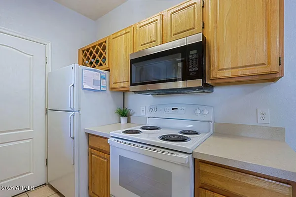 a kitchen with a sink a stove and a refrigerator
