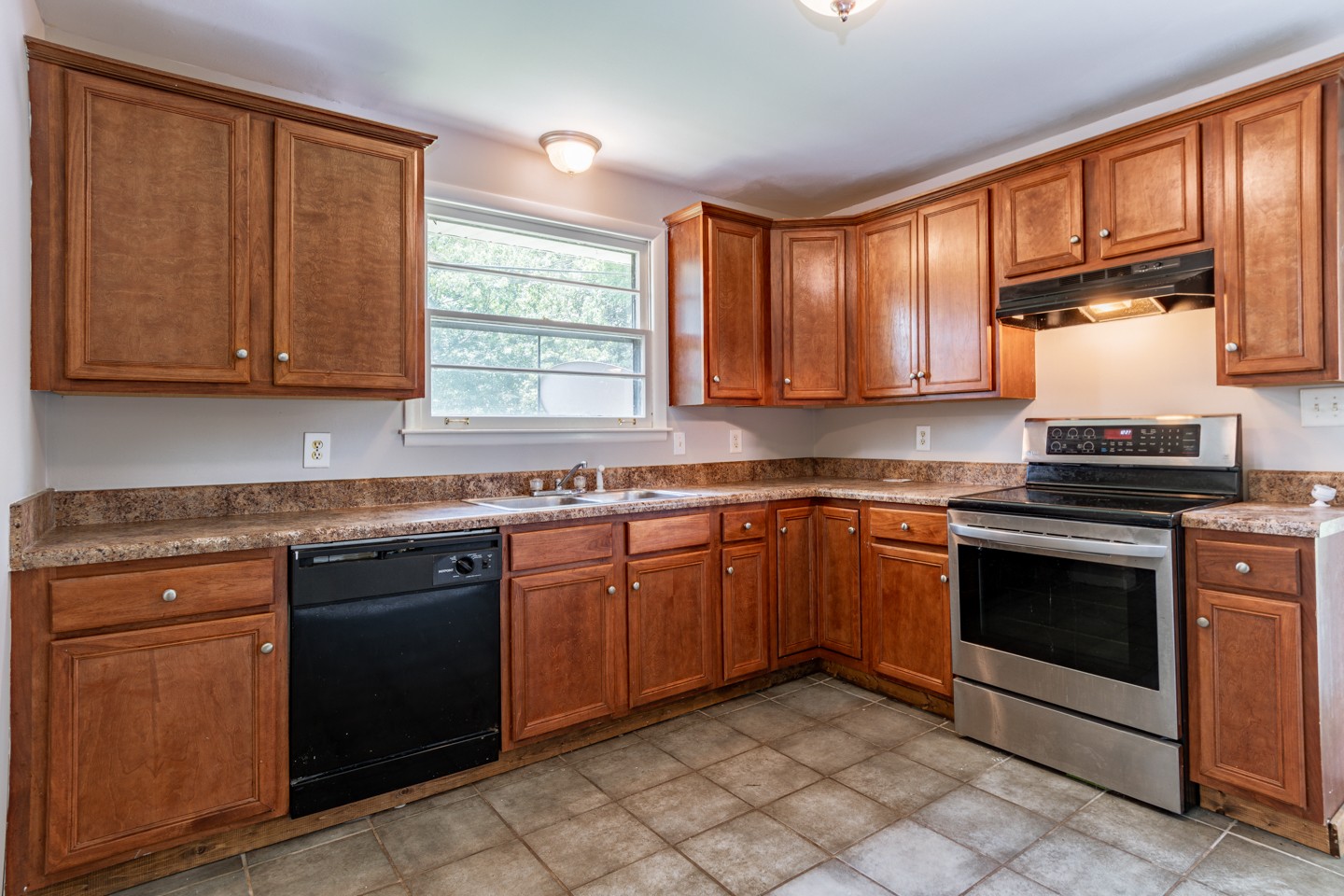1220 Substation Road Pleasant View, TN 37146 - Photo 8 of 15 a kitchen with granite countertop cabinets stainless steel appliances a sink and a window