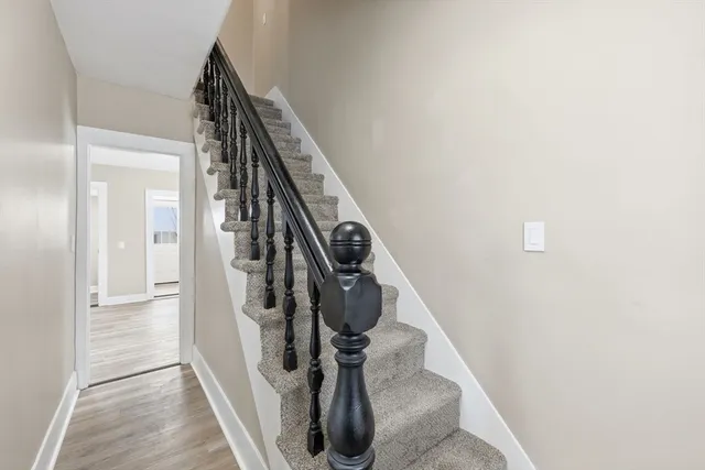 a bedroom with a bed and glass window