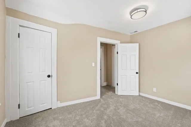 a view of empty room with wooden walls